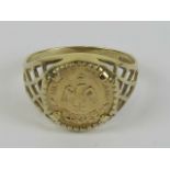 A 9ct gold 'coin' ring having pierced lattice work shoulders, size O-P, 2.2g.