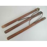 Three 19th century truncheons each with turned groove handles and brass end stop,