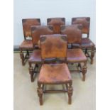 A set of six oak leather and studded dining chairs having cup and cover legs c1930s.