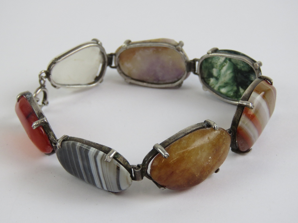 A seven panel Scottish hard stone bracelet, unmarked white metal, 19cm in length. - Image 2 of 2