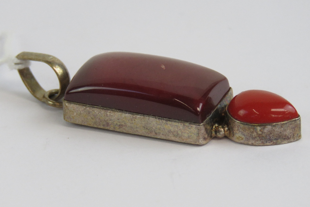 A large silver and red hard stone pendant, stamped 925,6.5cm in length inc bale. - Image 2 of 2