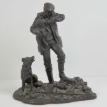 A bronze effect resin shepherd and lamb figurine.