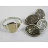 A pair of HM silver cuff links of oval form with floral engraving throughout,