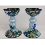 A pair of highly decorative cloisonné style pricket candlesticks (spikes deficient),