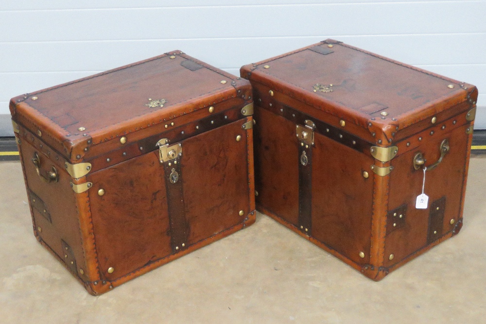 A fine pair of 'Army & Navy' style leather covered lidded trunks having brass Royal Corps of