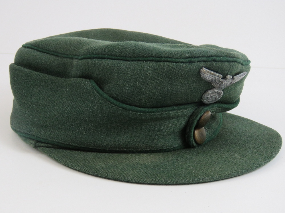 A WWII German Forestry Officers M43 style peaked cap having green piping and eagle over swastika - Image 2 of 5