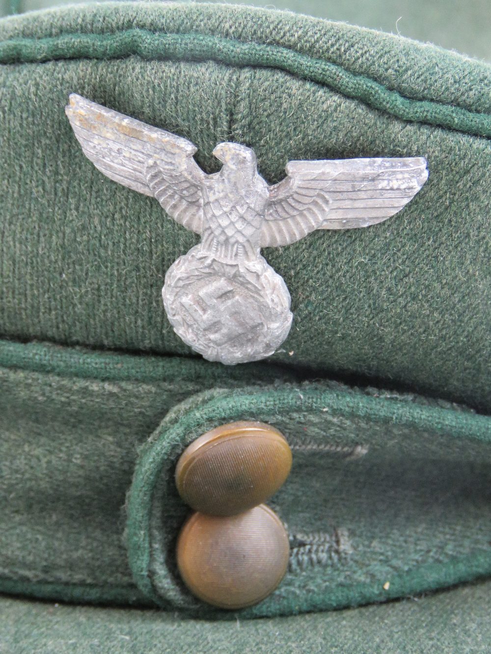 A WWII German Forestry Officers M43 style peaked cap having green piping and eagle over swastika - Image 3 of 5