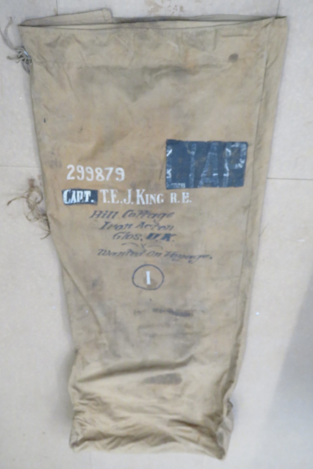 A WWII canvas bed roll marked for Capt. T.E.J. King RE 299879.