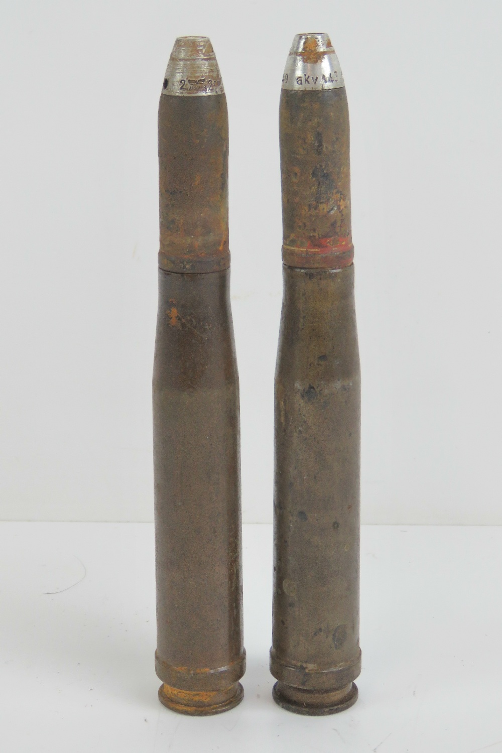 Two German 20mm inert shells with heads.