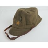 A WWII Japanese infantry cap with leather chin strap.