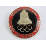 An enamelled WWII German Olympics badge dated 1936 and marked CTD to back, 4cm dia.