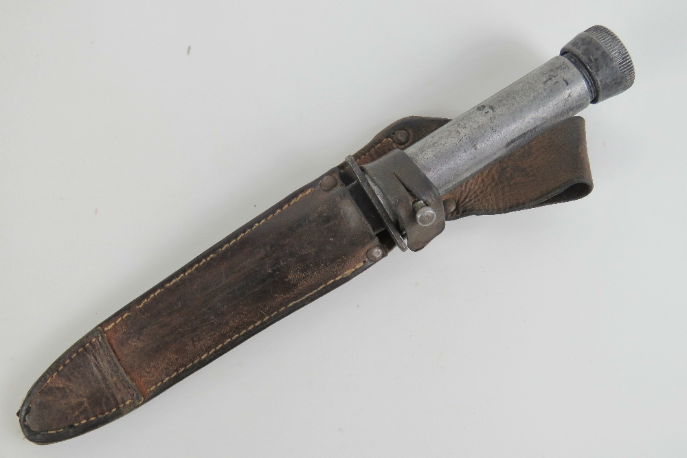 An unusual dagger having hollow tube grip opening to reveal compass within,