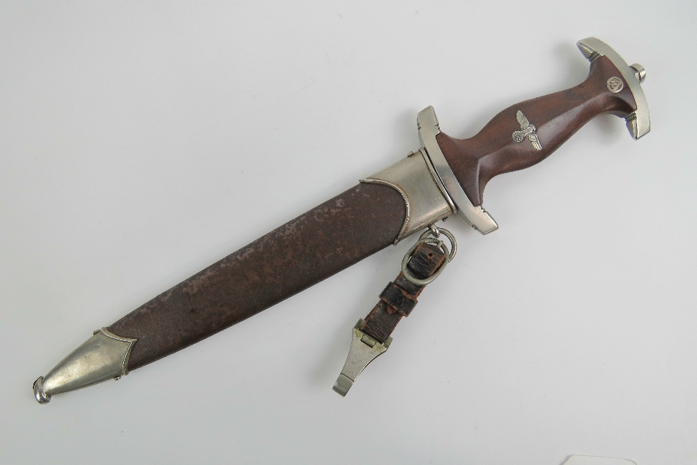 A WWII German SA dagger with full Rhom inscribed blade, having makers mark for E.