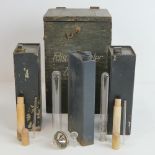 A German field testing kit including bottles and test tubes.