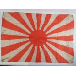 A WWII Japanese silk 'Rising Sun' flag measuring 89 x 62cm. Slightly a/f.