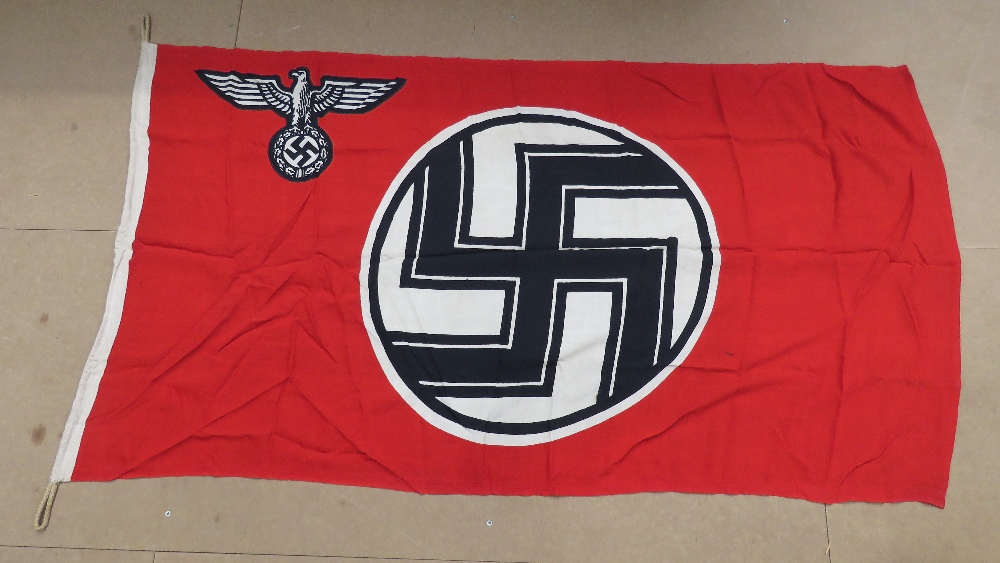 A WWII German Kriegsmarine war service flag, with maker markings and measuring 3ft x 5.5ft.