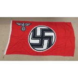 A WWII German Kriegsmarine war service flag, with maker markings and measuring 3ft x 5.5ft.