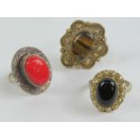 Three silver and hard stone rings; tiger