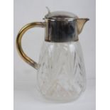 A cut glass and silver plated carafe jug