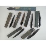 A quantity of six cut throat razors in original cases. Together with a special strop. Seven items.