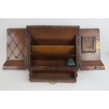 A Victorian walnut stationary box, doors opening to reveal compartments within, single drawer under,