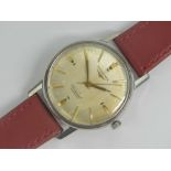 A vintage Longines Conquest automatic wristwatch c1960s having champagne dial with yellow metal