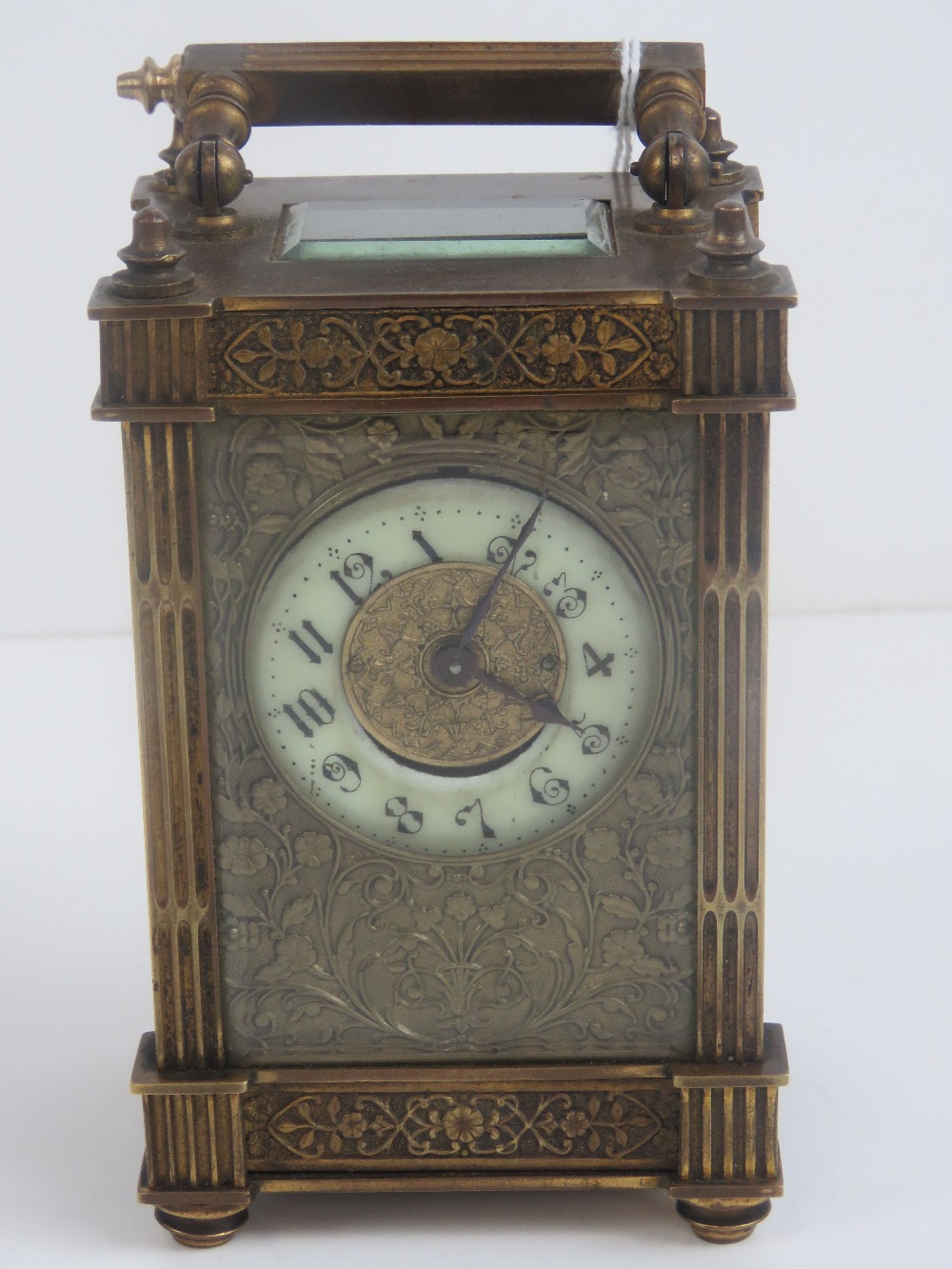 A 19th century five glass brass carriage clock having enamel dial with Arabic numerals,