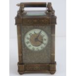 A 19th century five glass brass carriage clock having enamel dial with Arabic numerals,