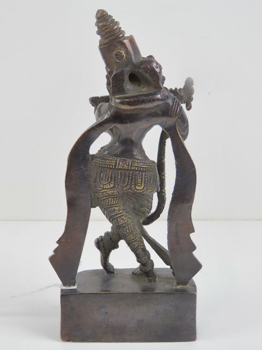 A 19th century cast brass Indo-Asian deity standing 21cm high. - Image 3 of 4