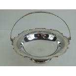 A good silver plated pierced Edwardian fruit dish with loop handle,