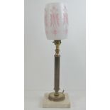A brass column table lamp with glass shade raised over marble square shaped base, for re-wiring,