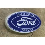 A contemporary illuminated Ford 'Authorised Service' wall sign measuring 59 x 30cm.