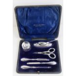 A HM silver dressing table set in presentation leatherette box, includes rouge pot, nail buffer,
