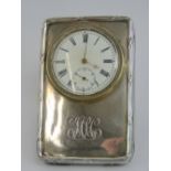 A HM silver miniature clock having Swiss movement with white enamel dial,