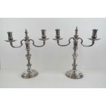 A pair of HM silver twin sconce candelabra having bobbin style column over circular base,