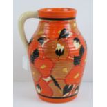 A Clarice Cliff orange Chintz handled jug, 29.5cm.