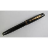 A vintage Parkette De Luxe 'self-filler' fountain pen with original 14ct gold nib.