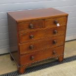 A short mahogany chest of two short over three long drawers over bracket feet having matching