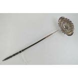 A white metal punch ladle having gadrooned bowl and twisted whale bone handle,
