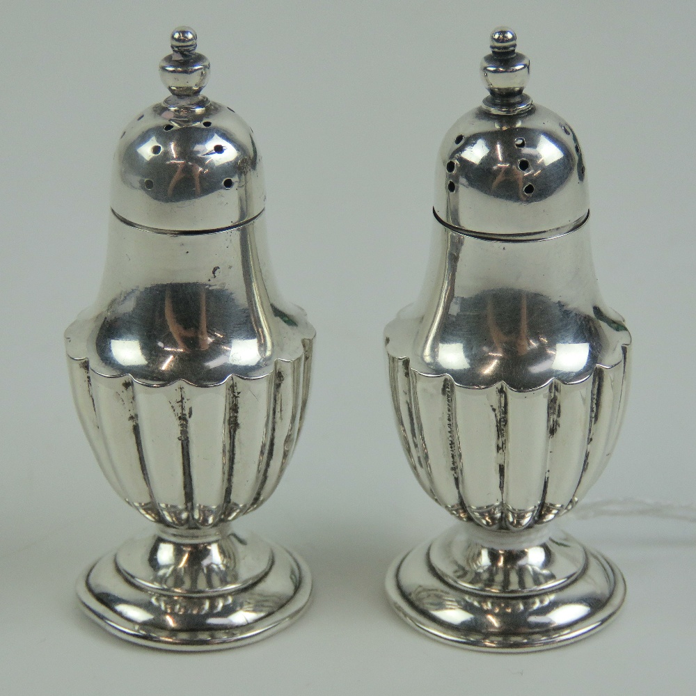 A pair of miniature HM silver pepperettes having gadrooned bodies and standing 6. - Image 2 of 3