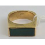 A vintage 9ct gold and green onyx ring of square form, stamped 9ct, size U, 12g.