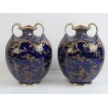 A good pair of cobalt blue and gilded Doulton Burslem vases, each bearing green backstamp,