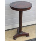 A 19th century circular Continental occasional table raised over tapering stem on triform base,