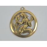 A 9ct gold pendant or charm having female with plant decoration, hallmarked 375, 21mm dia, 2.1g.