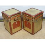 An unusual pair of brass covered and leather decorated square shaped military style travel trunks,