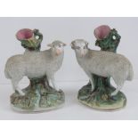 Staffordshire flatbacks; ram and ewe, an opposing spill vases, 19cm high, a/f.