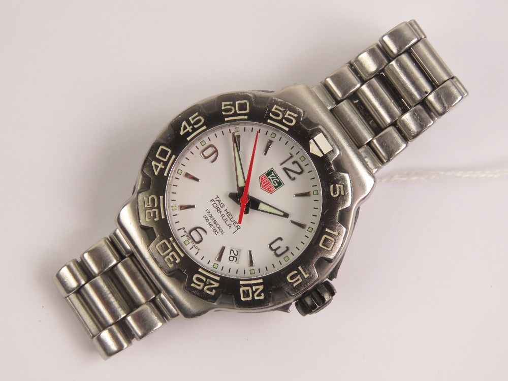 A Tag Heuer Formula 1 stainless steel wristwatch with original strap, white dial, date aperture,