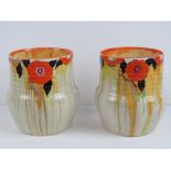 A Clarice Cliff Bizarre floral decorated pair of open planter vases each standing 16cm high.