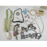 A quantity of assorted costume jewellery including Lotus faux pearl necklace and earrings in