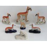 A single large Staffordshire Greyhound, 28cm, a standing pair each 19cm,